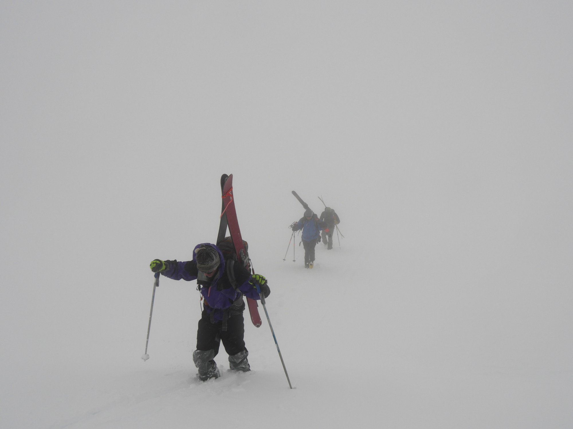 Skiers break a path along Glory ridge