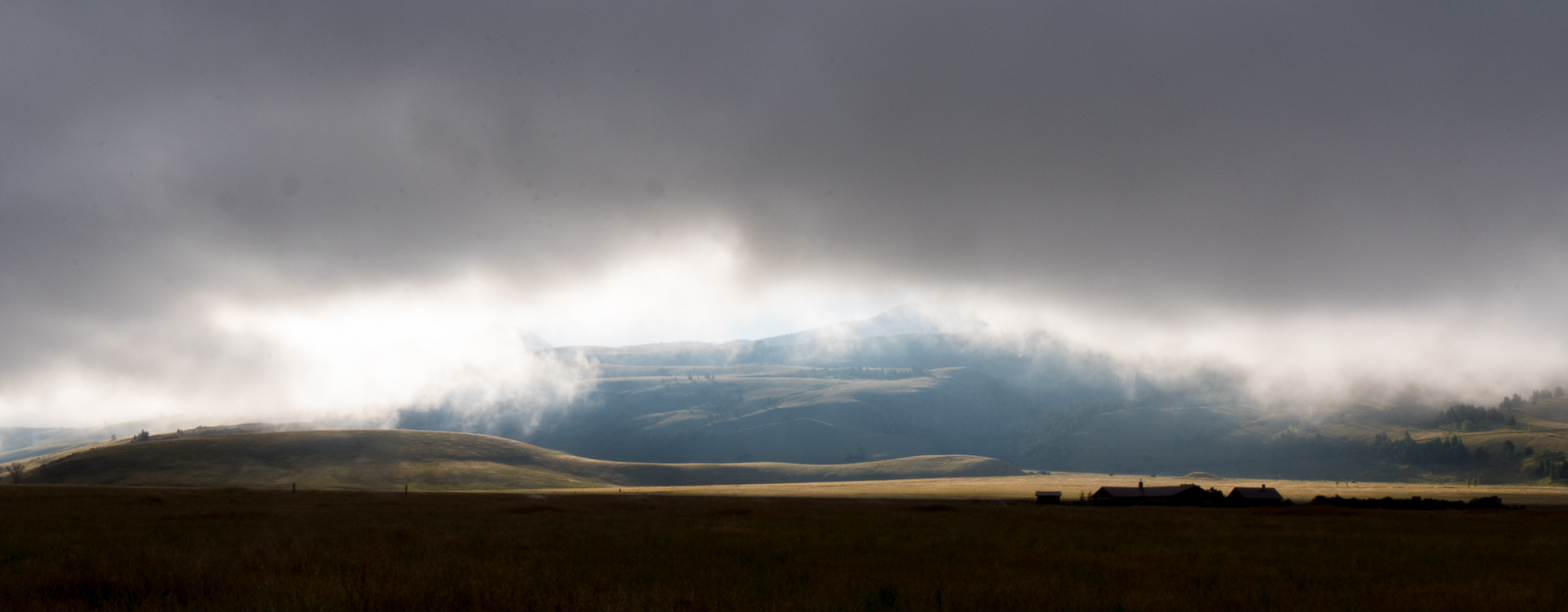 The hills at the edge of Curtis Canyon, viewed through morning fog from Elk Refuge Road